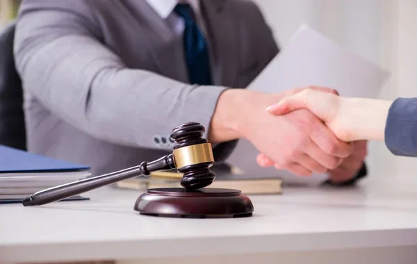 depositphotos_199148796-stock-photo-lawyer-discussing-legal-case-with